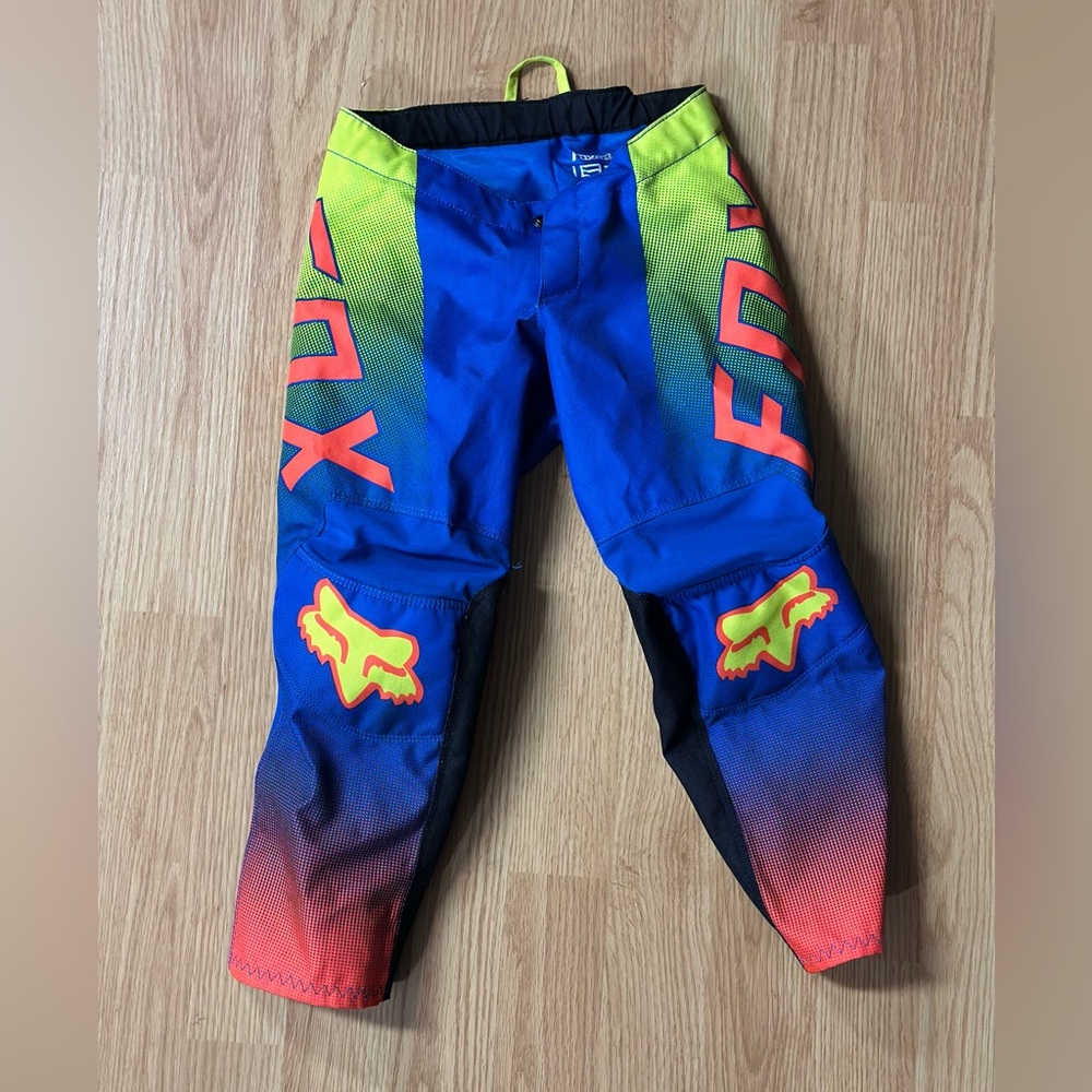 Kids size 4t fox racing pants minimal wear blue and yellow pattern.